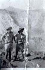 Tom Cogan (right) and mate, Rabaul 1942 in front of volcano